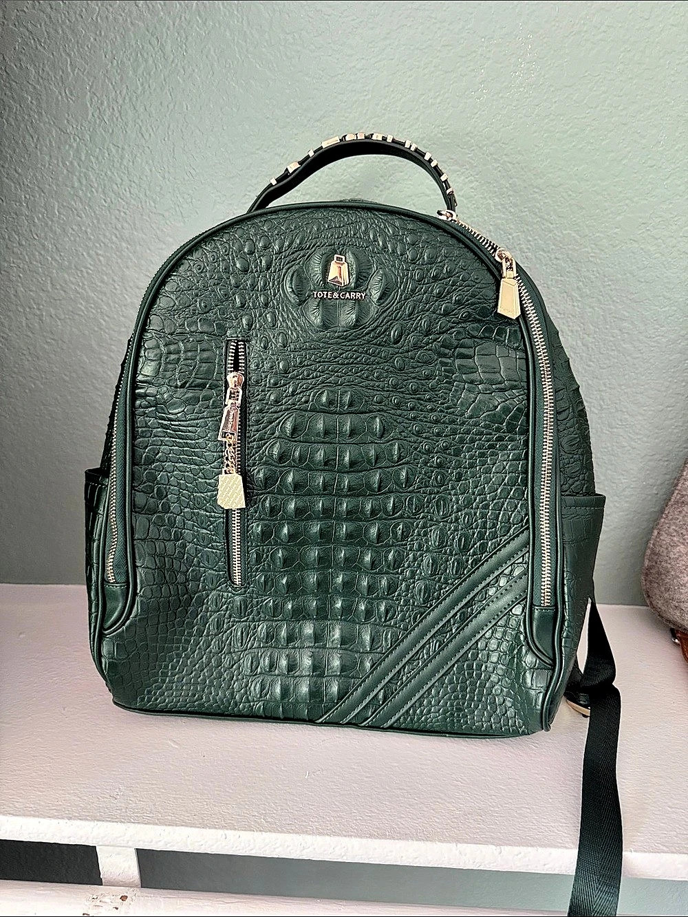 Tote & Carry Statement Traveler Backpack Crocodile Embossed Green